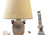 a lamp that is sitting next to a lamp on a table