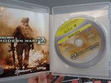 a person holding a dvd case with a game on it