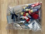 a plastic bag filled with assorted items on a wooden table