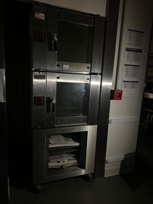 an image of a microwave oven in a dark room