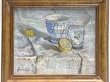un tableau représentant des citrons et une tasse posés sur une table