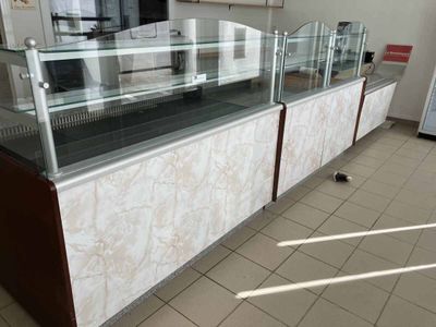 a glass display case in the middle of a room