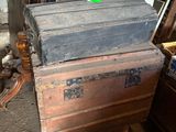 a stack of old wooden boxes sitting on a table