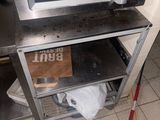 a microwave that is sitting on a shelf in a kitchen