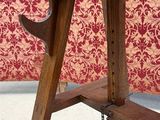 a small wooden table with a drawer on top of it