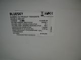 a label on the back of a white refrigerator