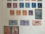an old picture of a collection of stamps on a piece of paper