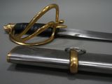 a close up of a pair of swords on a table