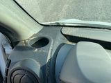 a dirty dashboard of a car on the street