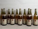 several bottles of wine are lined up on a table