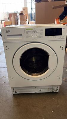 a washing machine that is sitting on the floor