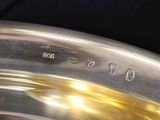 a close up of a silver plate with numbers on it