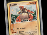 a close up of a card with a picture of a dragon on it