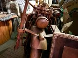 a motorcycle that is sitting in a room full of stuff