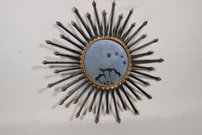 une photo d'un rayonnement solaire réalisé avec des brindilles et un miroir