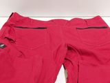 the pants are red and have black zippers on them
