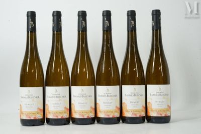 six bottles of wine are lined up in a row on a table