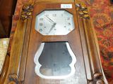 a clock sitting on a table in a room