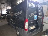 a black van that is parked in a garage