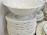 a lot of plates and bowls stacked on top of each other