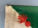 a green and white bag with a red flower on it