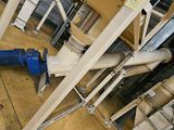 a blue and white water pump sitting on the floor