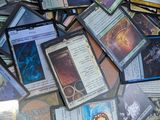 a pile of cards on a table with a lot of them