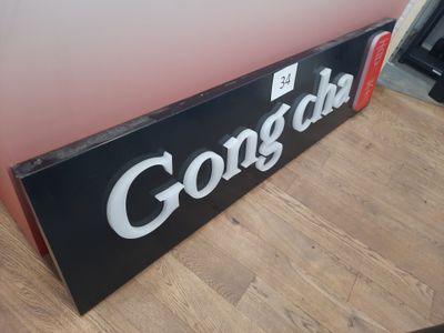 a sign that says gorgola on it sitting on the floor