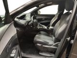 the interior of a car with the door open and the driver ' s seat down