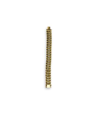 a close up of a gold bracelet on a white background