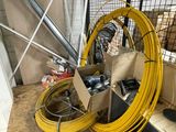 a box of wires sitting on the floor next to a box of wires