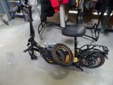 a scooter that is sitting on the floor in a room