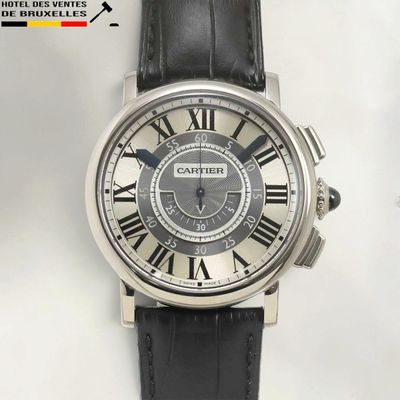 a close up of a watch with roman numerals on the face