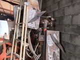 a pile of tools sitting on the floor in a room