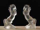 pair of glass figurines of a man and a woman