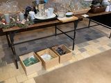 a table with a lot of items on it in front of a store