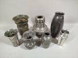 many different types of vases on a white surface