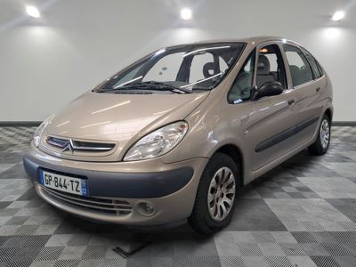 a picture of a small car parked in a garage