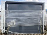 a lot of plastic wrapped up on the back of a truck