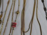 a lot of necklaces that are on a table