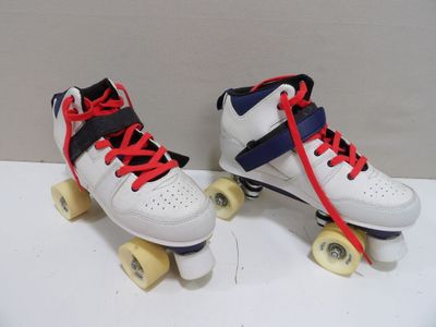 pair of white roller skates with red and blue laces on them