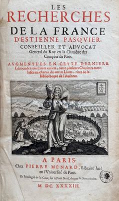 an old book with a picture of a woman holding a child
