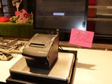 a printer sitting on top of a desk next to a monitor