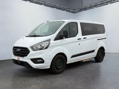 the white van is parked in a large room