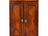 an antique wooden cabinet with two doors and two drawers