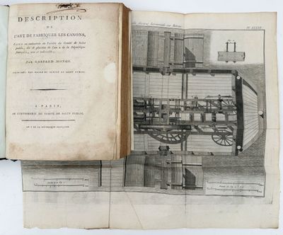 an open book with a drawing of a steam engine on it