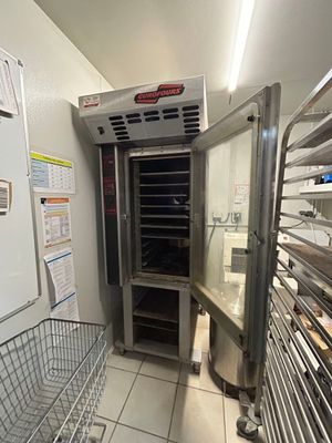 an image of a commercial kitchen with stainless steel racks