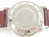 an image of a close up of a watch on a white surface