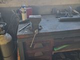 an image of a workbench with a lot of tools on it