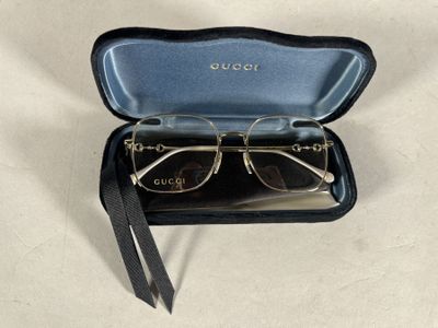glasses in a black case on a table with a white background